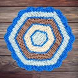 Hexagonal doily in blue, beige, and brown