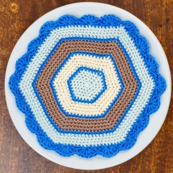 Hexagonal doily in blue, beige, and brown