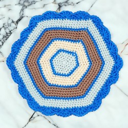 Hexagonal doily in blue, beige, and brown